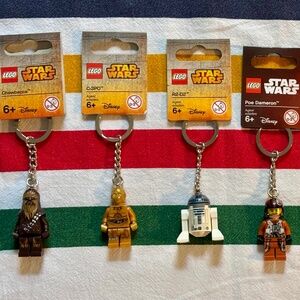 BUNDLE OF SIX LEGO STAR WARS keychains, all with tags attached. UNUSED.